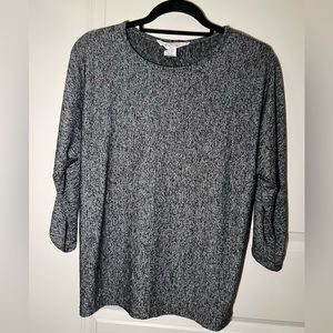 Black and grey patterned shirt with mid-length sleeves.